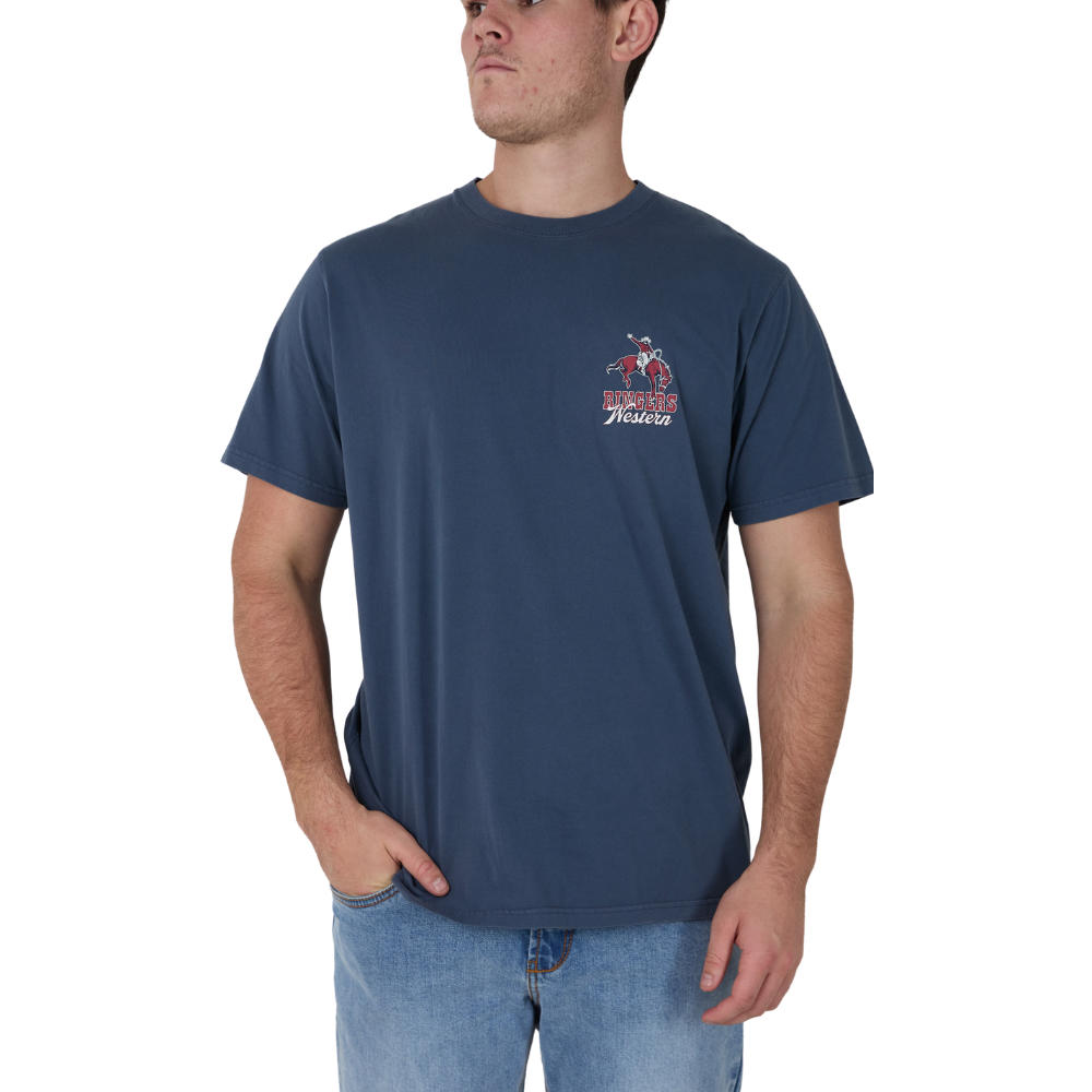 A man wearing a navy Ringers Western Men's Australian Cowboy Loose Fit Short Sleeve T-Shirt (125125RW) with a small 'Ringers Western' graphic on the left chest, paired with light blue jeans, against a plain white background.