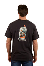 A man is seen from the back wearing a Ringers Western Mens Bottoms Up Loose Fit S/S Tee in washed black, featuring a colorful hand holding a can graphic with "Bottoms Up" and "Ringers Western" printed beneath.