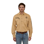 A man wearing a Ringers Western Mens Hawkeye Half Button L/S Work Shirt in Dark Sand, blue jeans, and a belt stands facing forward against a plain white background.