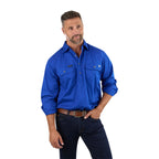 A man with short salt-and-pepper hair and a beard wears the Ringers Western Mens King River Half Button Work Shirt (171110002) in Royal and dark jeans, standing with one hand in his pocket against a white background.