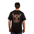 A man wears the Ringers Western Men's Ringers Buck Loose Fit S/S Tee in black, featuring an illustrated deer head and antlers on the back with “Ringers Big Buck” and “Ringers Western” text in orange and white.