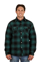 A man with short brown hair, wearing blue jeans and the Ringers Western Mens Sawyer L/S Sherpa Flannel Shirt in Pine/Charcoal, smiles while facing forward against a plain white background, highlighting this classic winter workwear piece.