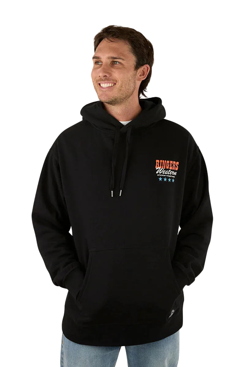 A man smiles against a white background, wearing the Ringers Western Mens Stickin Together Pullover Hoodie in black, featuring a front pocket, brushed fleece finish, and "RINGERS Western" with stars on the chest.