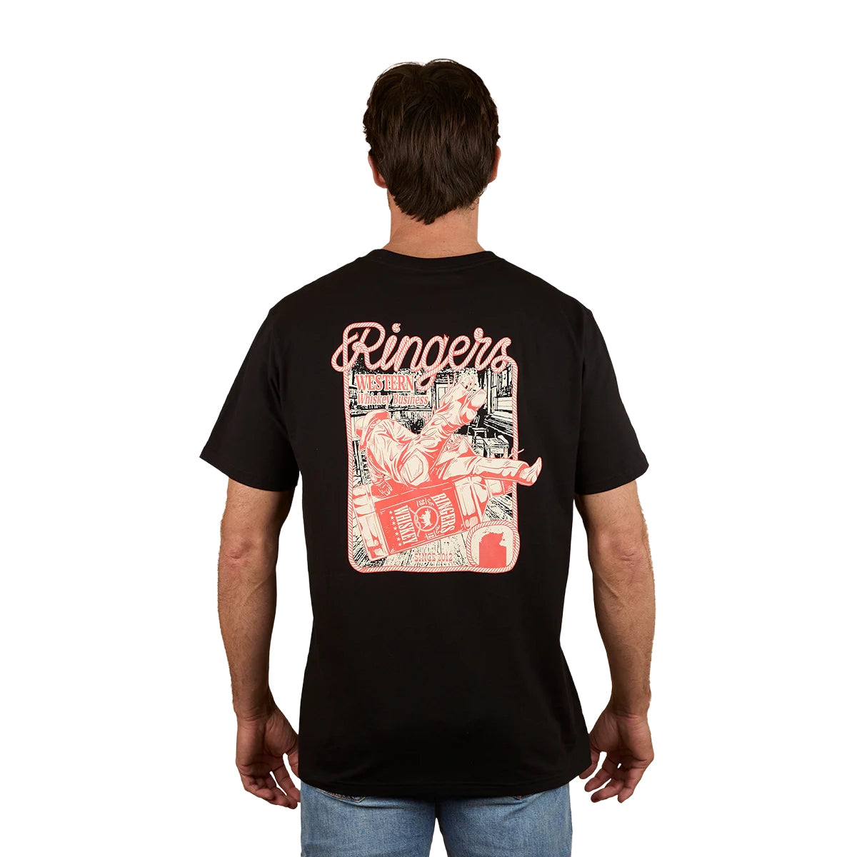 A man stands against a plain white background wearing the Ringers Western Men's Whiskey Business Loose Fit S/S Tee (125036RW) in black, featuring a cartoon character with a boombox printed in red and white on the back. Crafted from 100% cotton jersey.