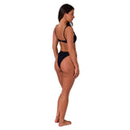 A woman from a 3-4 back view modelling a black Ringers Western Women's Luna Lace Front Bralette Top (225209RW) on a white background.
