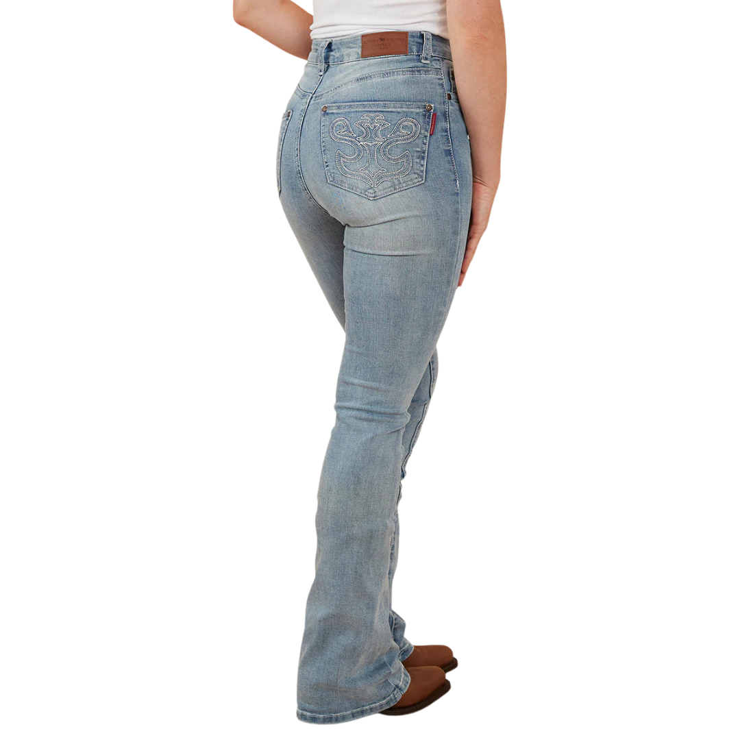 A woman viewed from behind wearing light blue Ringers Western Women's Penny Rodeo High Rise Bootleg Jeans (222104RW) with a white top and brown boots, shown from the waist down against a plain white studio background.