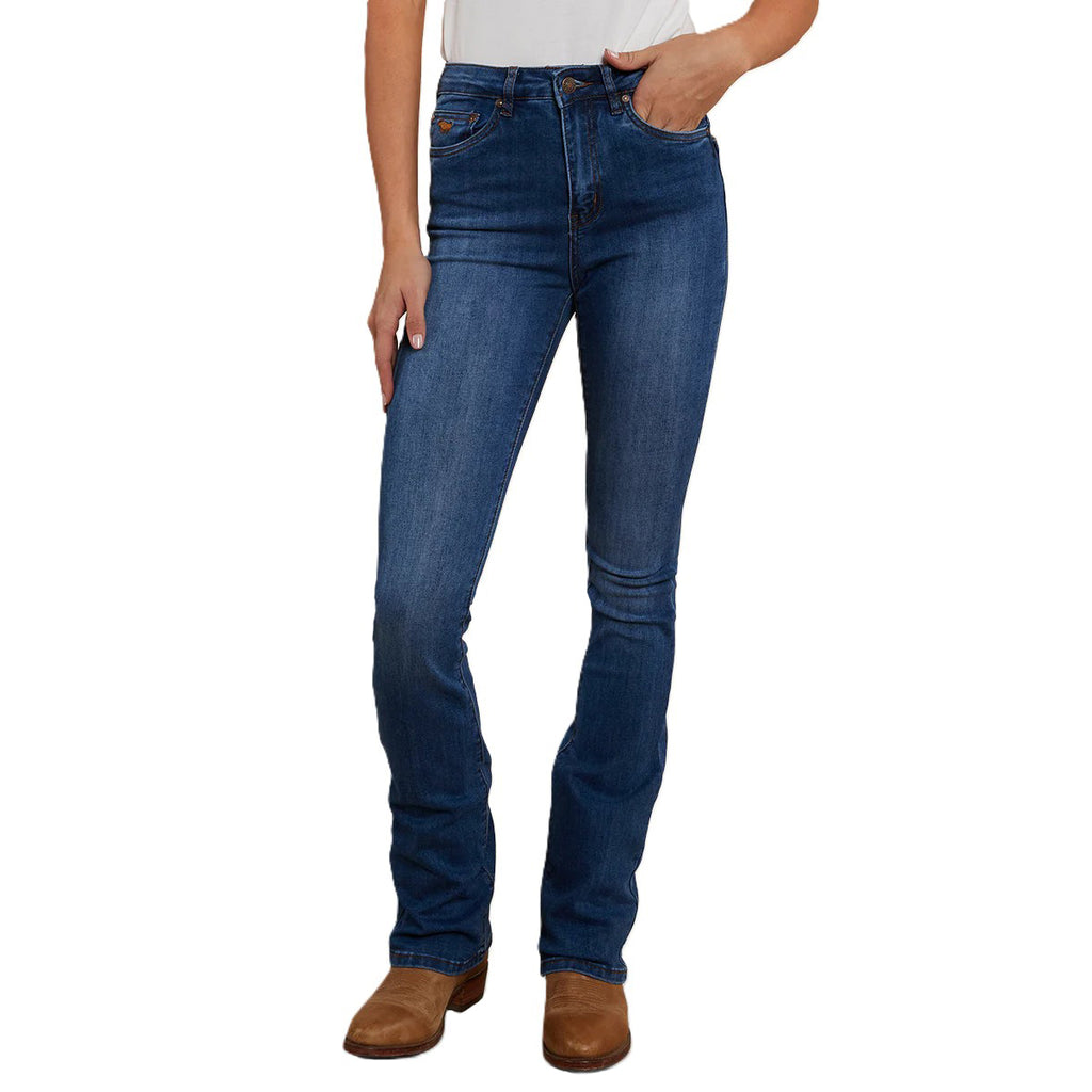 A woman modelling a pair of Vintage Blue Wash Ringers Western Women's Penny Rodeo High Rise Bootleg Jeans (222104RW) on a white studio background.