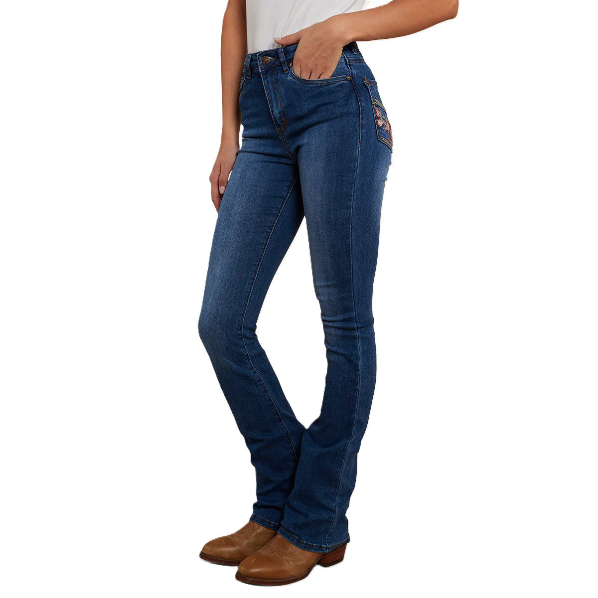 A 3-4 front view of a woman modelling a pair of Vintage Blue Wash Ringers Western Women's Penny Rodeo High Rise Bootleg Jeans (222104RW) with floral embroidery on the back pockets, on a white studio background.