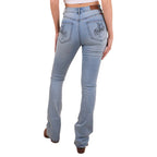 A woman viewed from behind from the waist down modelling vintage light blue Ringers Western Women's Penny Rodeo High Rise Bootleg Jeans (222104RW) with a black rodeo rider print on the back pockets, paired with a brown belt, boots and a white crop top on a white studio background.