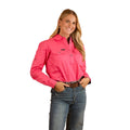A woman with long blonde hair smiles, wearing the Ringers Western Womens Pentecost River Half Button L/S Work Shirt in Melon and blue jeans. She stands against a white background with her hands in her front pockets.
