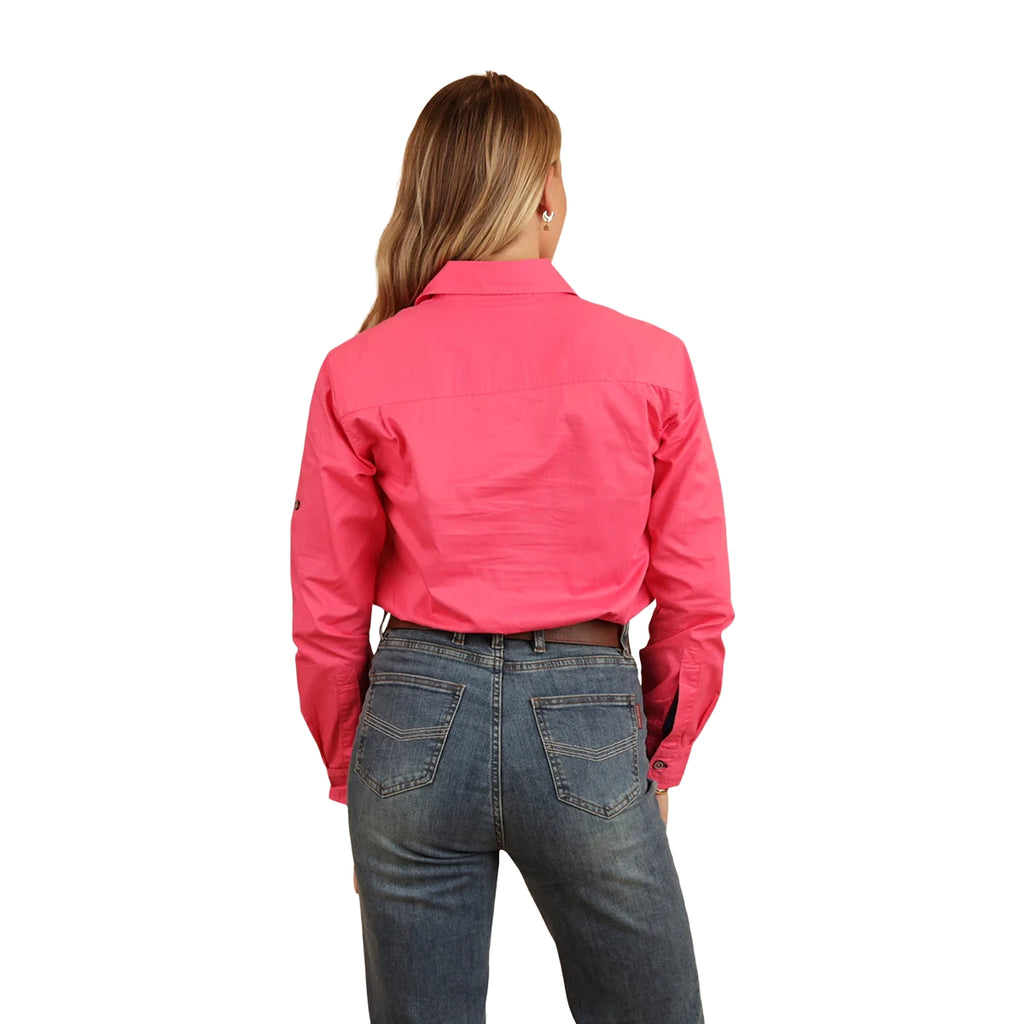 A woman with long blonde hair smiles, wearing the Ringers Western Womens Pentecost River Half Button L/S Work Shirt in Melon and blue jeans. She stands against a white background with her back to the camera.