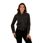 A woman with long brown hair wears the Ringers Western Womens Sarina L/S Shirt (225063RW) in washed black, paired with a black belt and pants, smiling against a white background.