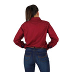 A woman with her back to the camera, wearing the Ringers Western Womens Pentecost River Half Button Work Shirt in Burgundy, standing against a plain white background.