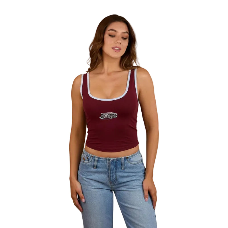 A woman wearing a Ringers Western Womens Villa Ringer Tank in Burgundy/Light Blue and light denim shorts with embroidered back pockets, set against a white background.