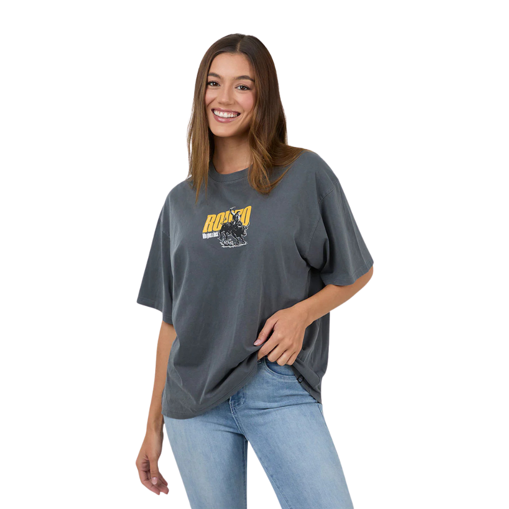 Woman wearing a Ringers Western Womens Who Gives A Buck S/S Oversized Tee (225120RW) Washed Black on a white background