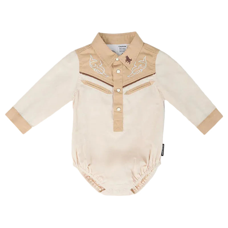 A baby long-sleeve bodysuit in beige and tan, styled like a western shirt with embroidered details on the chest, a buttoned placket, and elasticized cuffs and leg openings, shown on a white background.