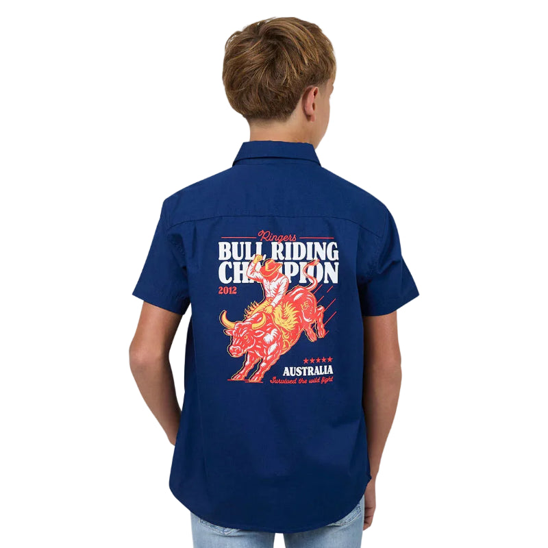 Child wearing a blue shirt with a bull riding champion design on the back