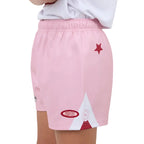 Pink shorts with a star and mountain design on a white background