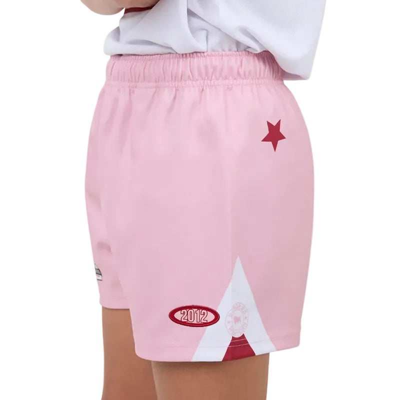 Pink shorts with a star and mountain design on a white background