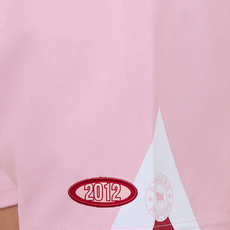 Pink shorts with a red star and 2012 logo on a white background