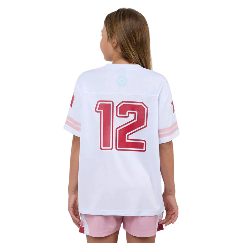 Girl wearing a white sports jersey with red numbers on a white background