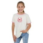 Young girl wearing a white t-shirt with pink trim and a red horseshoe design on a white background