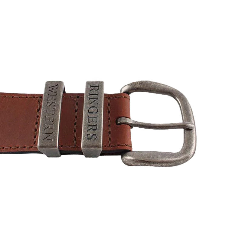 A close-up of a tawny brown Ringers Western James Belt (419222065) with a silver toned metal buckle, featuring embossed branding on the keepers.