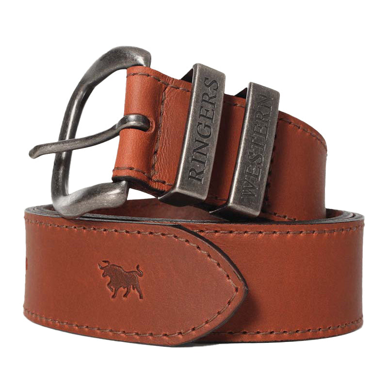 A close-up of a tawny brown Ringers Western James Belt (419222065) with a silver toned metal buckle, featuring embossed branding on the keepers.