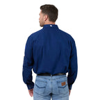 Man wearing a blue shirt with a logo on the back, standing against a white background