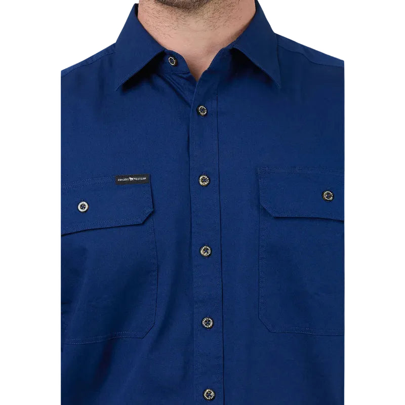 Close-up of a blue button-up shirt with a brand logo on a white background