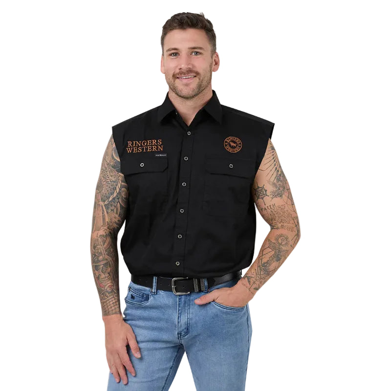 A man wearing a black sleeveless button-up shirt with 'Ringers Western' embroidered on the chest, paired with blue jeans and a black belt, against a white background.