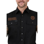 A close-up of a man wearing a black button-up shirt with 'Ringers Western' embroidered in orange on one side and a circular logo patch above the other chest pocket.