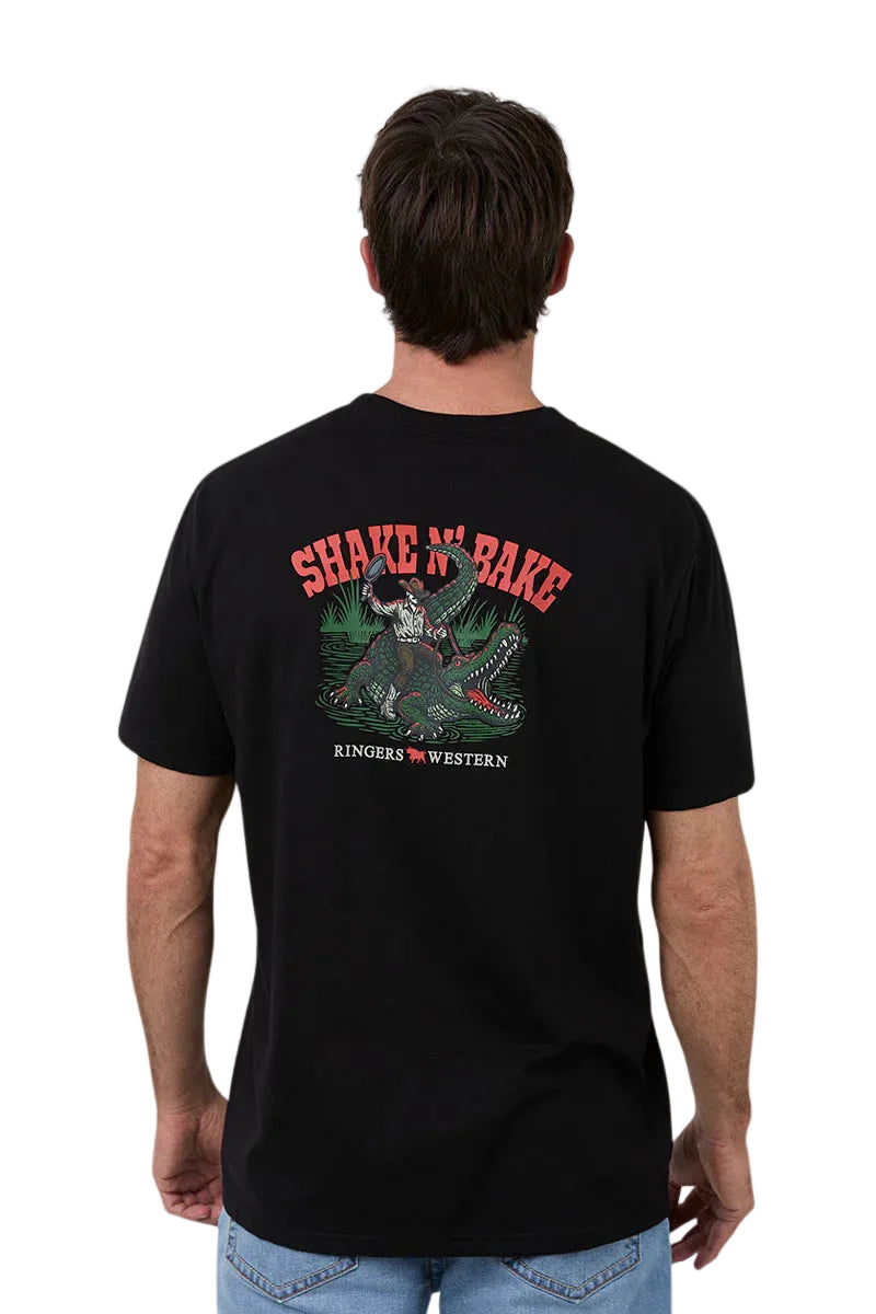 Person wearing a black t-shirt with a graphic design and text on the back, on a plain background