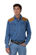 Man wearing a blue denim shirt with brown shoulder patches on a white background