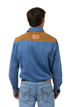 Man wearing a blue denim shirt with brown shoulder patches on a white background