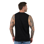 A man with tattooed arms is shown from the back wearing a black sleeveless muscle tank top and light blue jeans against a plain white background.