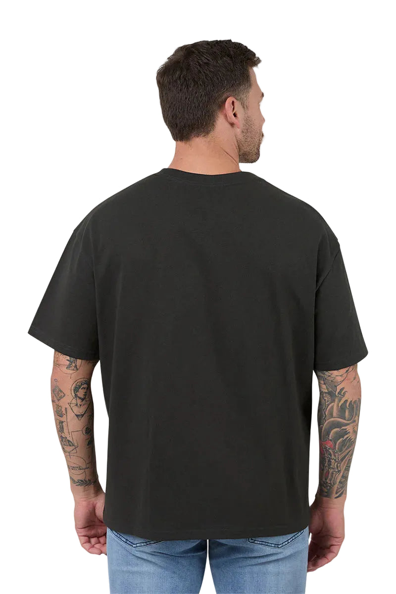 Man wearing a black t-shirt with a plain back on a white background