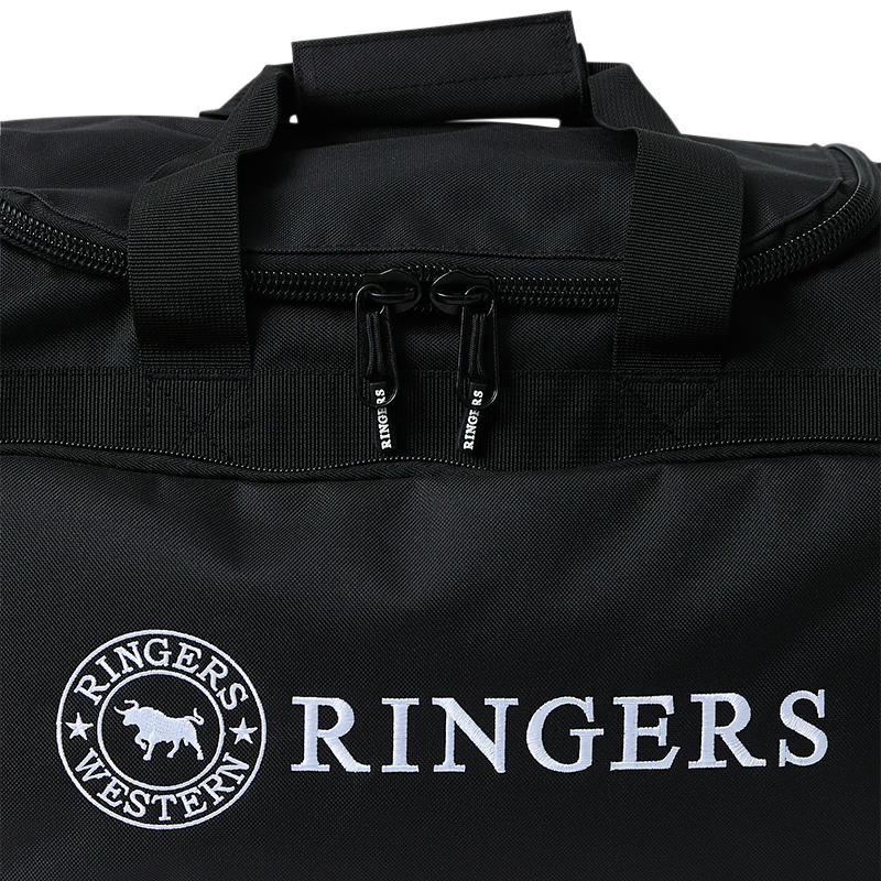 A close up of a black Ringers Western Rider Go Sports Bag (625130RW) duffel bag with white printed branding, featuring top handles and zip detail, and a large 'RINGERS' logo on the front pocket on a white background.