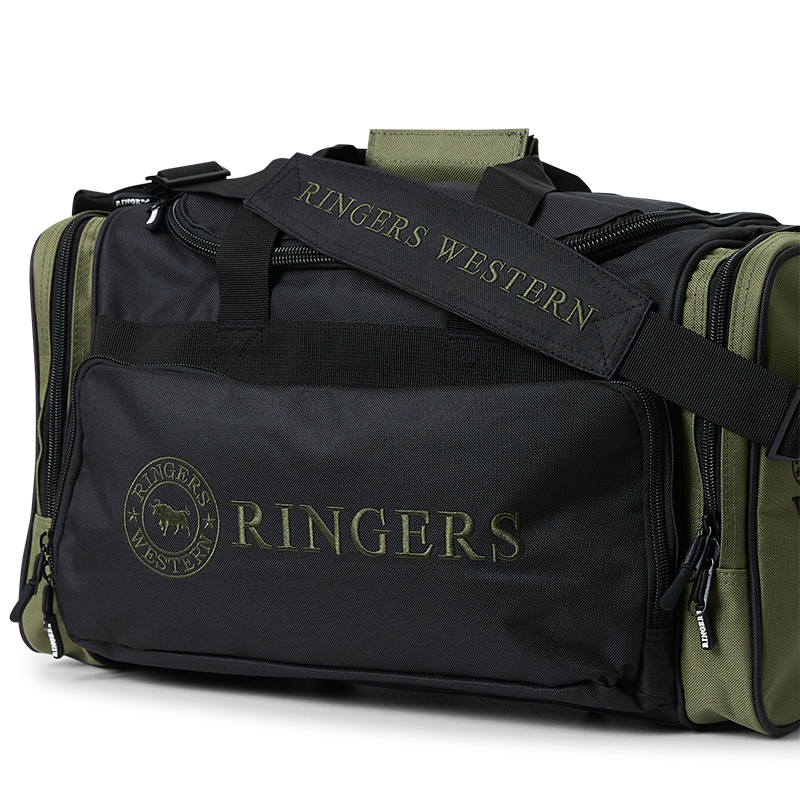 A black and army Ringers Western Rider Go Sports Bag (625130RW)  duffel bag with 'Ringers' branding on the front and side, featuring top carry handles, a shoulder strap and zippered top and side pockets, photographed on a clean white background.