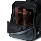 A black and charcoal Ringers Western Rider Go Sports Bag (625130RW) duffel bag with 'Ringers' branding, featuring a top carry handle and showing the zipped end compartment with a pair of brown chelsea boots in it.
