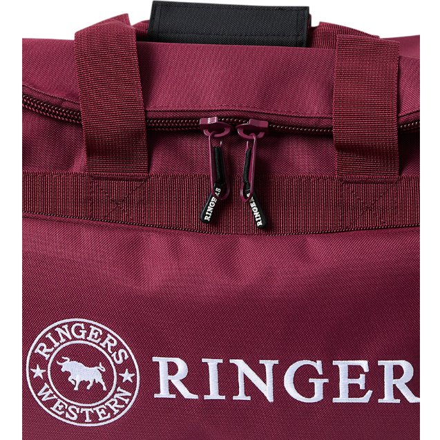 A close up of the handle and zip detail on a burgundy and black Ringers Western Rider Go Sports Bag (625130RW) duffel bag with white 'Ringers' branding on a white background.