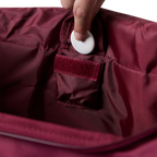 A burgundy and black Ringers Western Rider Go Sports Bag (625130RW) showing a small inside compartment for valuables.