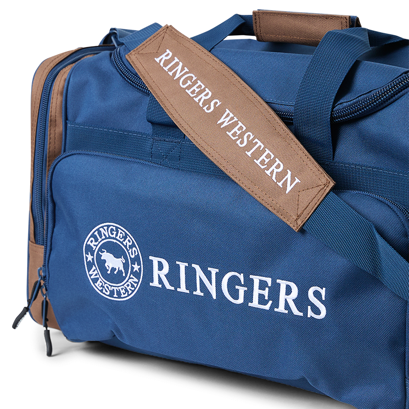 A navy and brown Ringers Western Rider Go Sports Bag (625130RW) duffel bag with 'RINGERS' printed in white on the front and 'RINGERS WESTERN' on the side, shown on a plain white background.