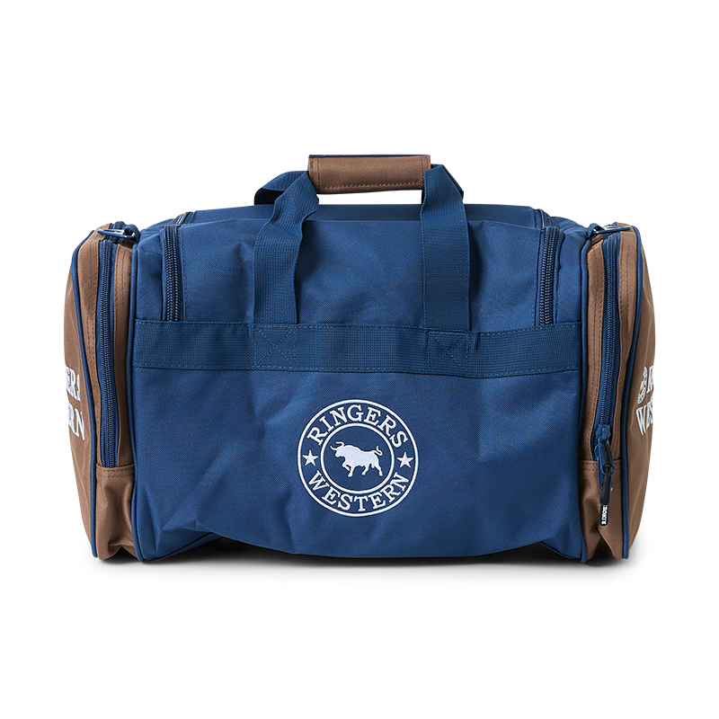 A back view of a navy and brown Ringers Western Rider Go Sports Bag (625130RW) duffel bag with a round 'RINGERS WESTERN' logo printed in white, shown on a plain white background.