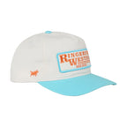 A white baseball cap with a light blue visor and matching light blue button, featuring a front patch that reads 'Ringers West' in orange on a white background