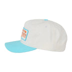 A white baseball cap with a light blue visor and a orange and blue patch on the front, shown against a white background.