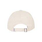 A light cream-colored baseball cap shown from the back, featuring a matching fabric strap and silver metal buckle, set against a solid white background.