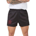 Person wearing charcoal grey shorts with a red logo on a white background