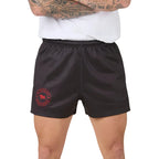 Person wearing charcoal grey shorts with a red logo on a white background