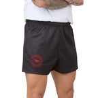 charcoal grey shorts with a red logo worn by a person on a white background